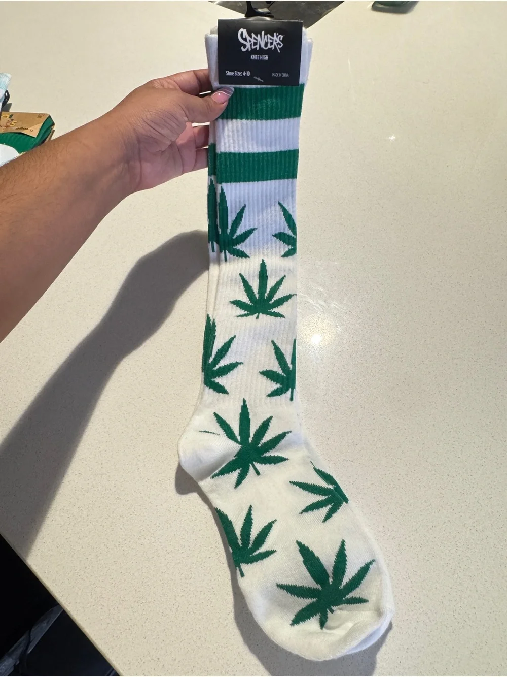Spencer's White Knee-High Socks with Green Cannabis Leaf Pattern